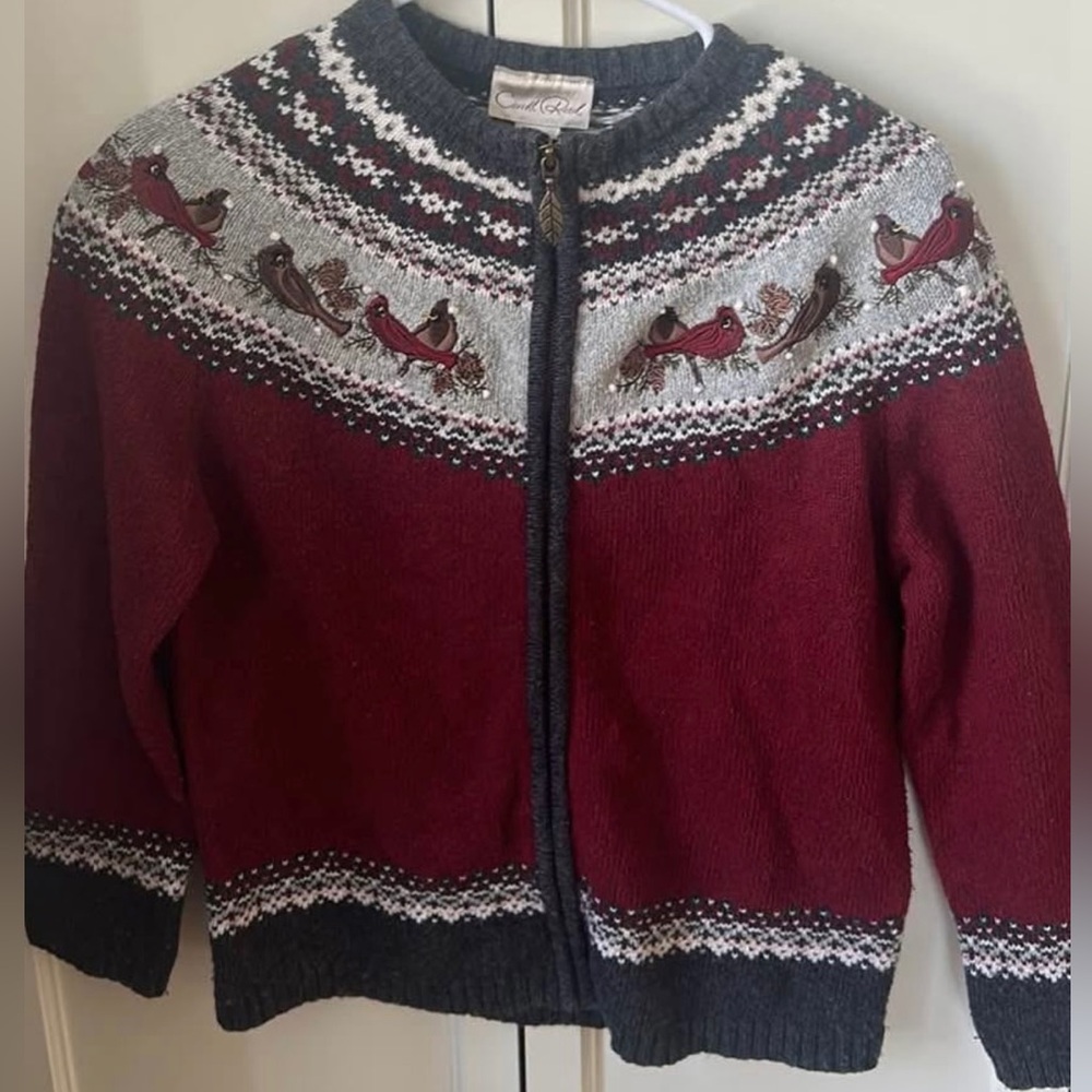 Vintage zip up sweater with birds & snow pattern on it.